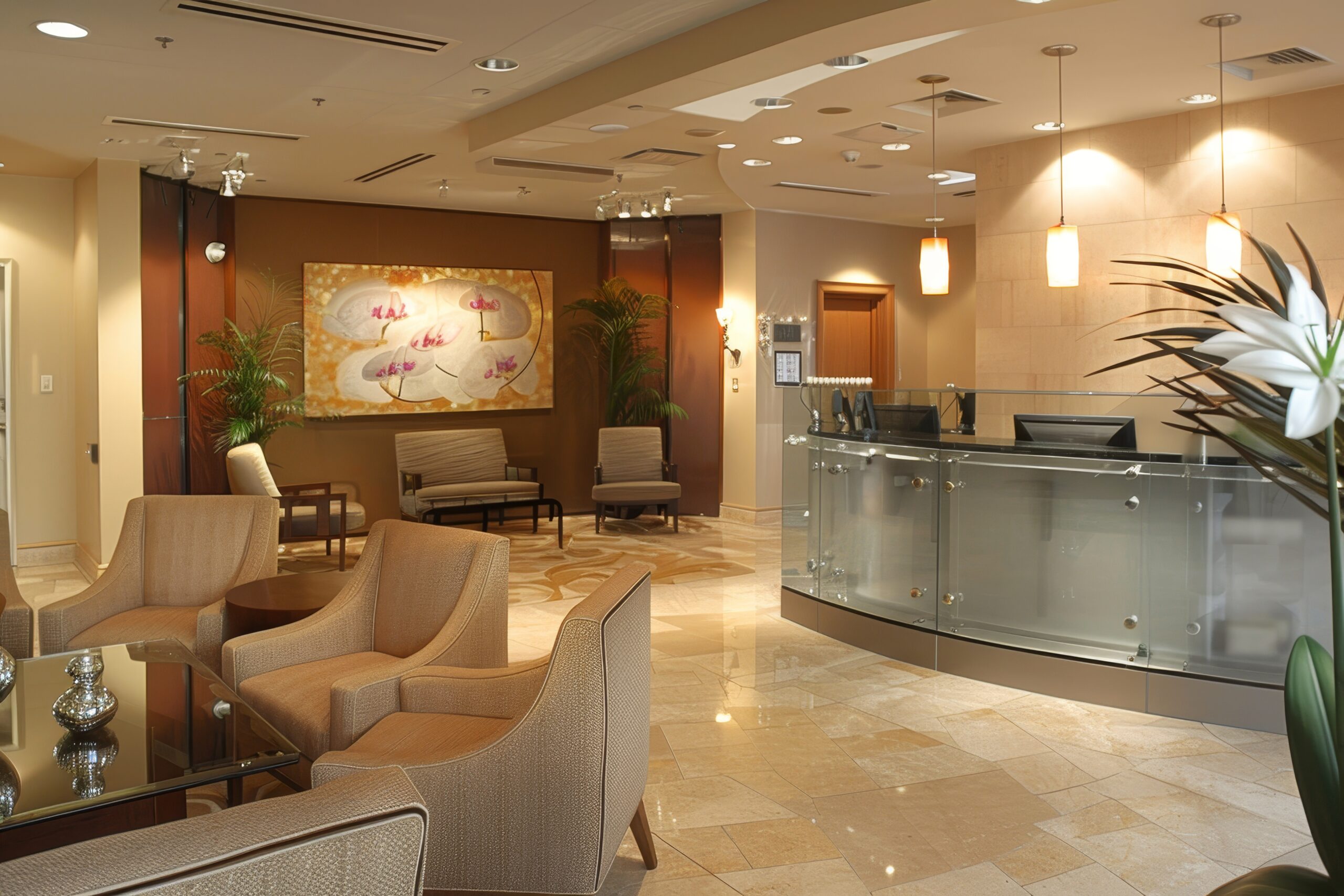 A modern reception area with a glass front desk, comfortable seating, and a large artwork, A reception area with a glass front desk and a waiting area with comfortable chairs